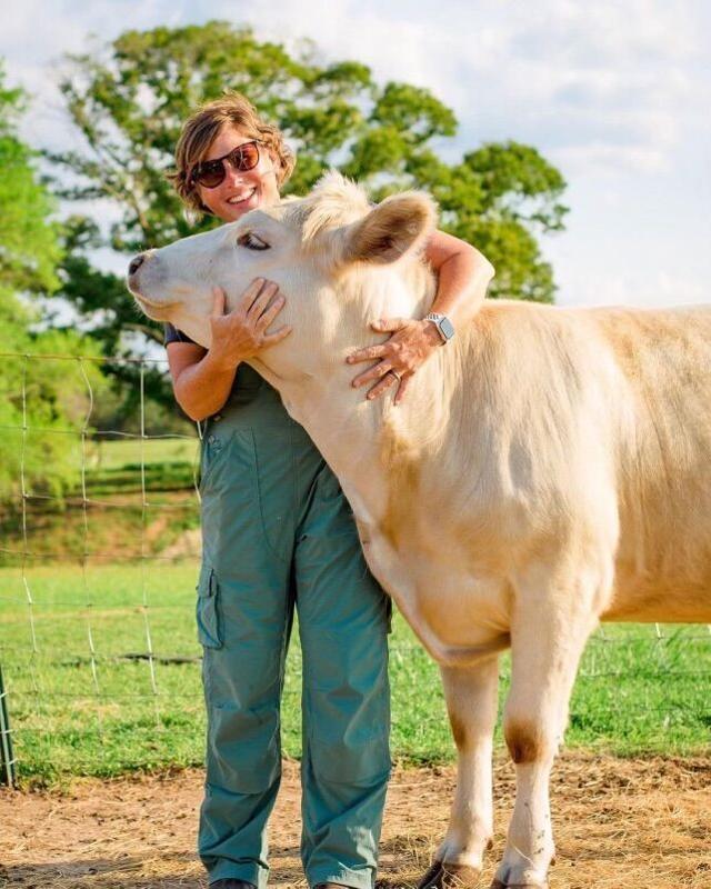 Bush Hog Female Farmer with cow